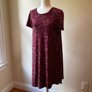 LuLaRoe Carly NWT. Feathers. Pocket. Size Small SM S